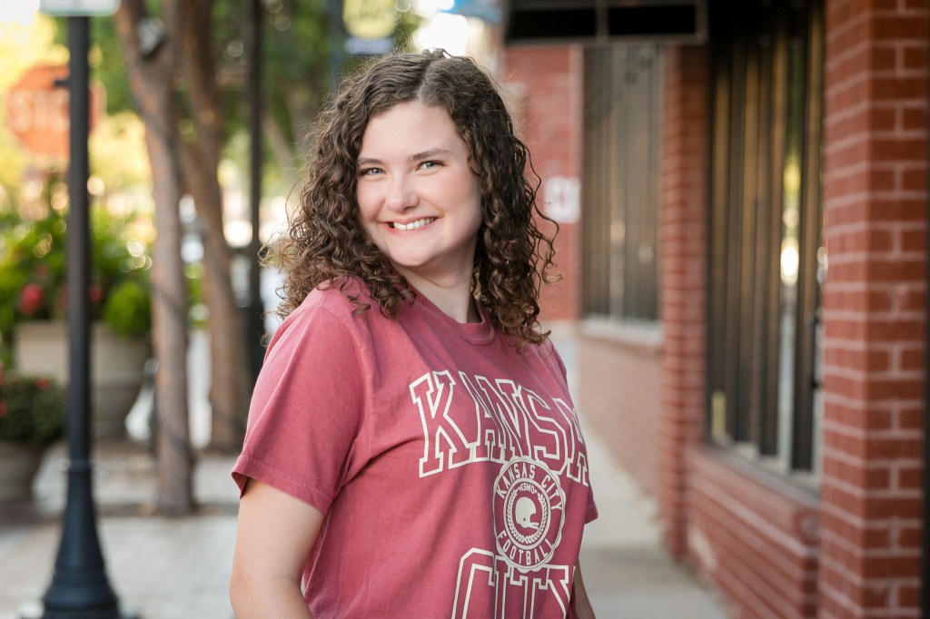 high school senior feeling confident in front of the camera Blue Springs