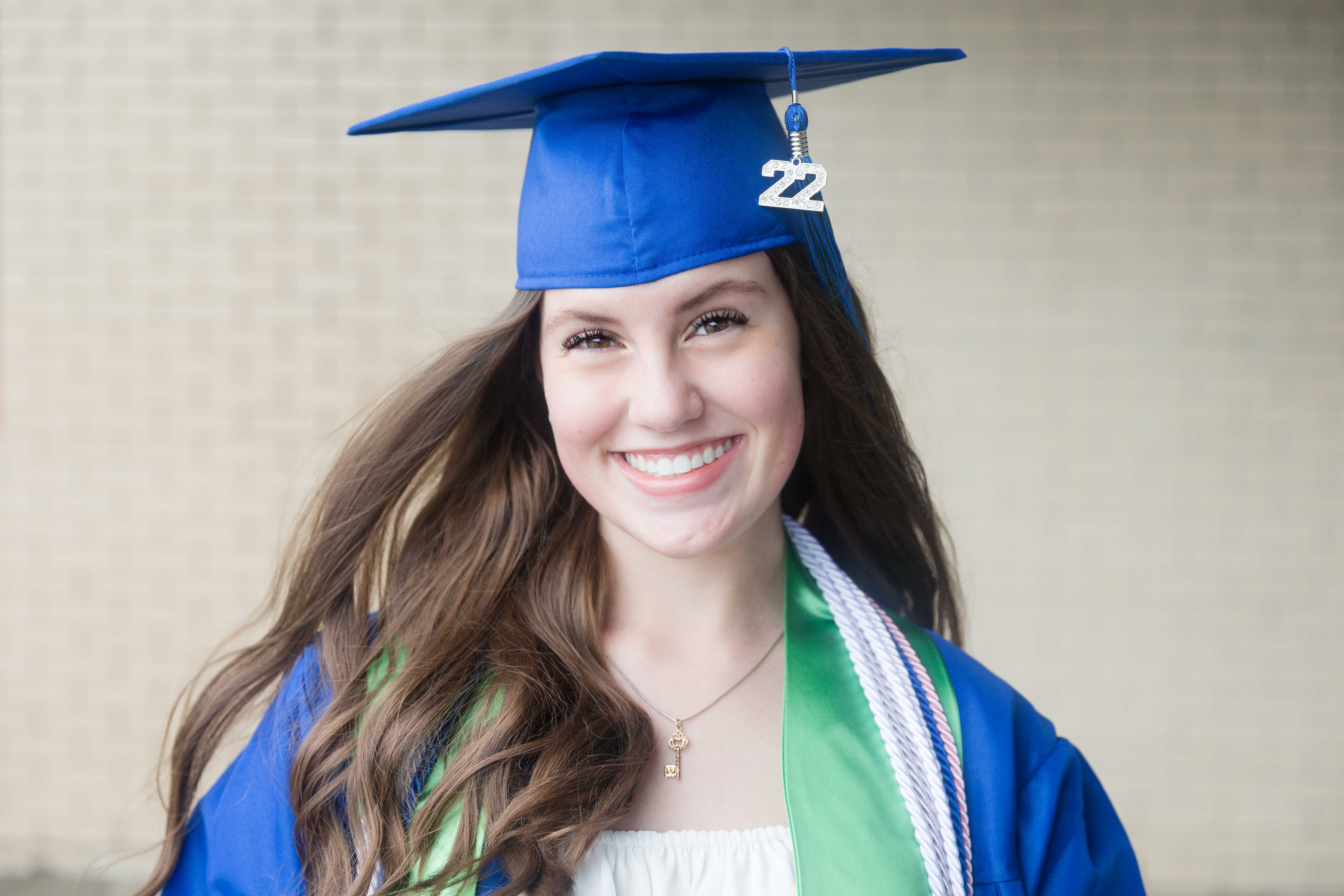 Senior girl during a cap and gown session in Blue Springs, Mo photographed by Case Studios Photography